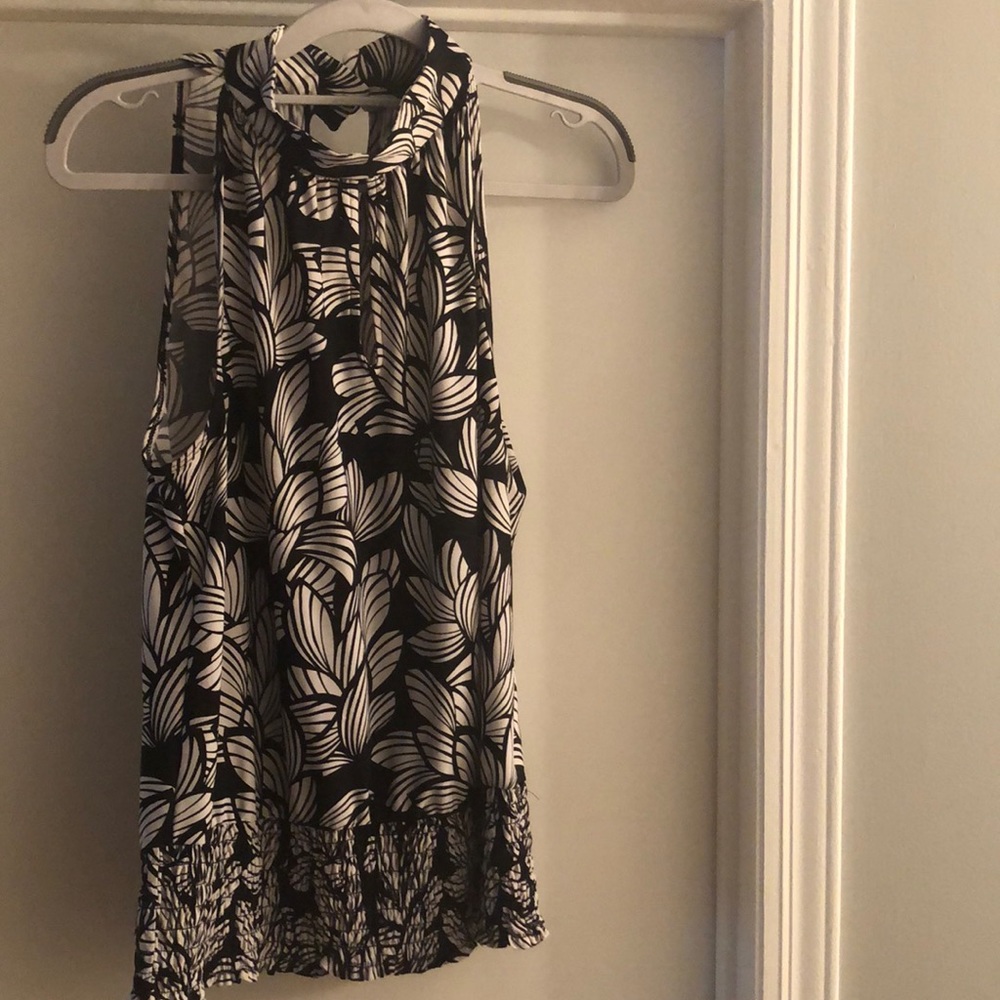 Essentials sleeveless mock turtleneck blouse.